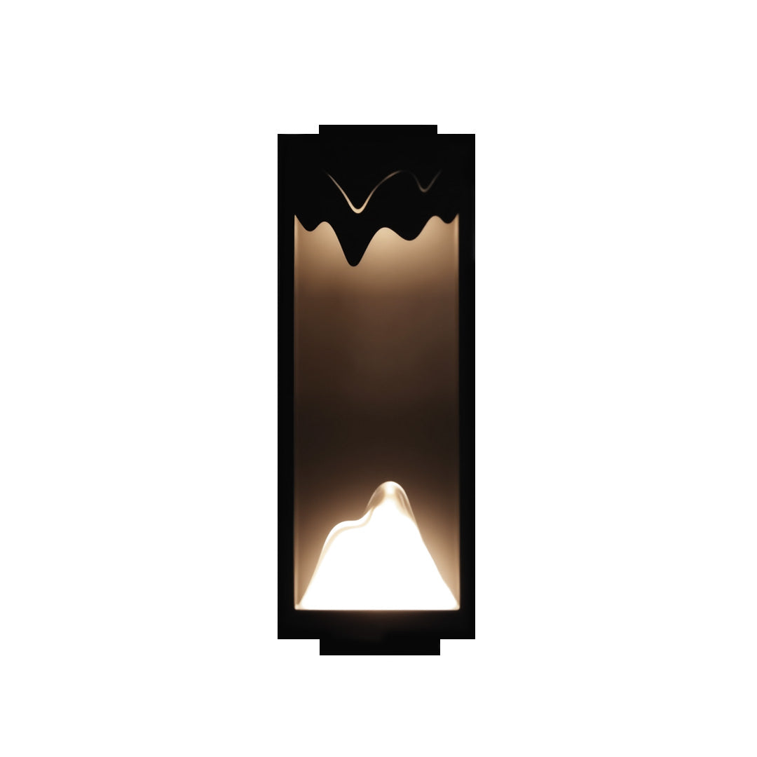 Sleek outdoor wall lighting ideas presenting tall vertical fixture with zigzag cutout design for dramatic lighting effect