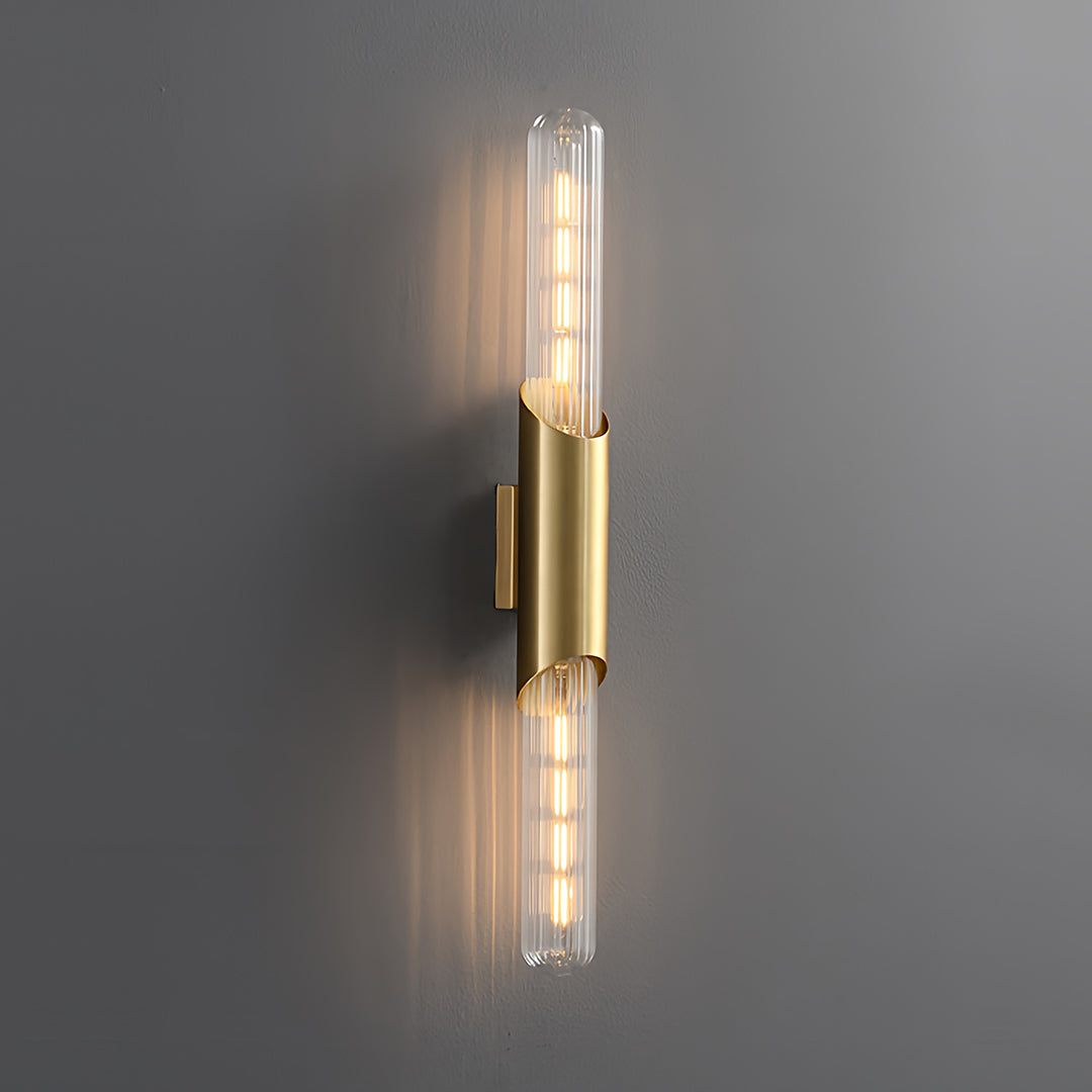 Sleek up down wall lights in gold, enhancing the ambiance of a modern living space with soft lighting.