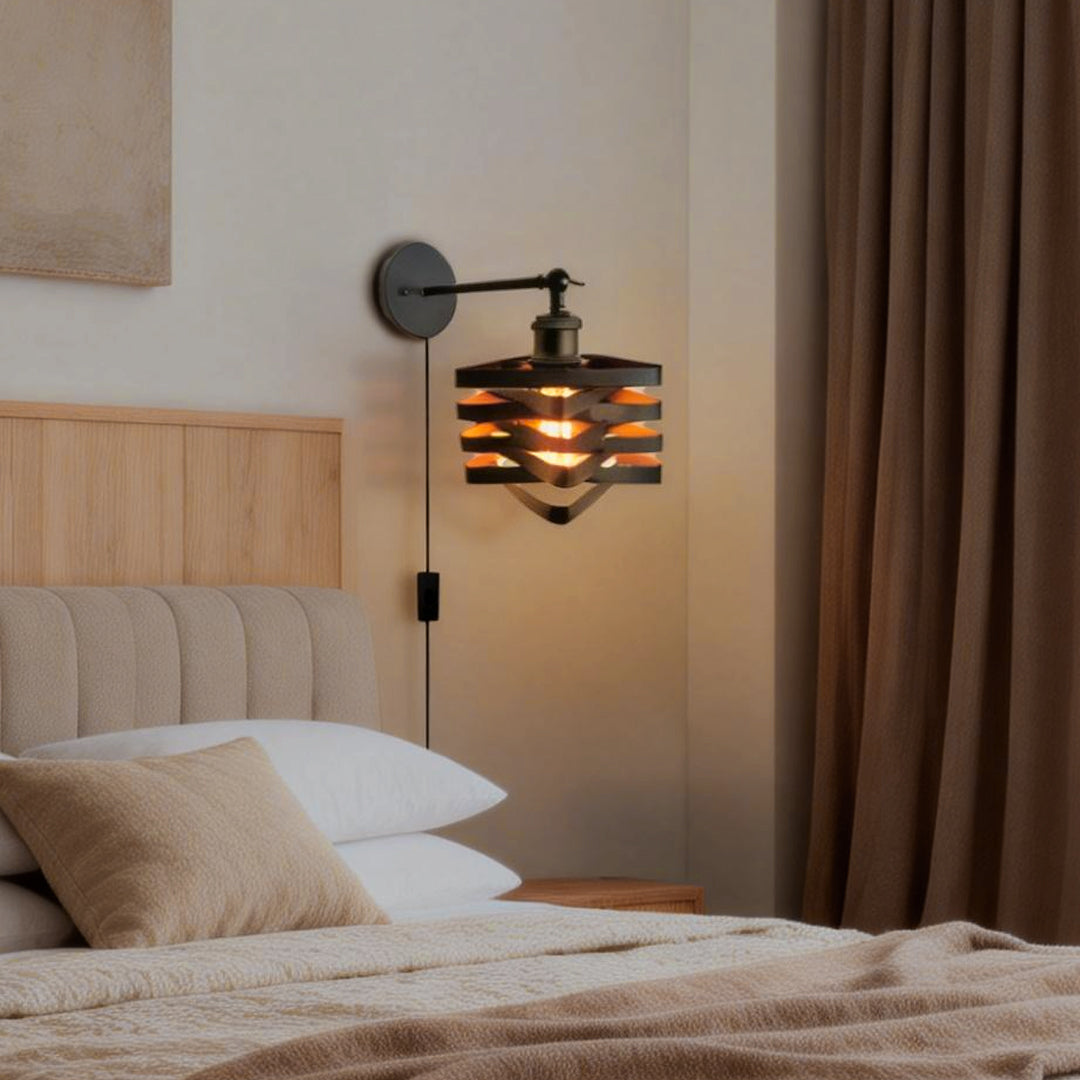 Sleek wall mount lights with plug, casting a soft glow in a modern bedroom with a gray headboard and decor.