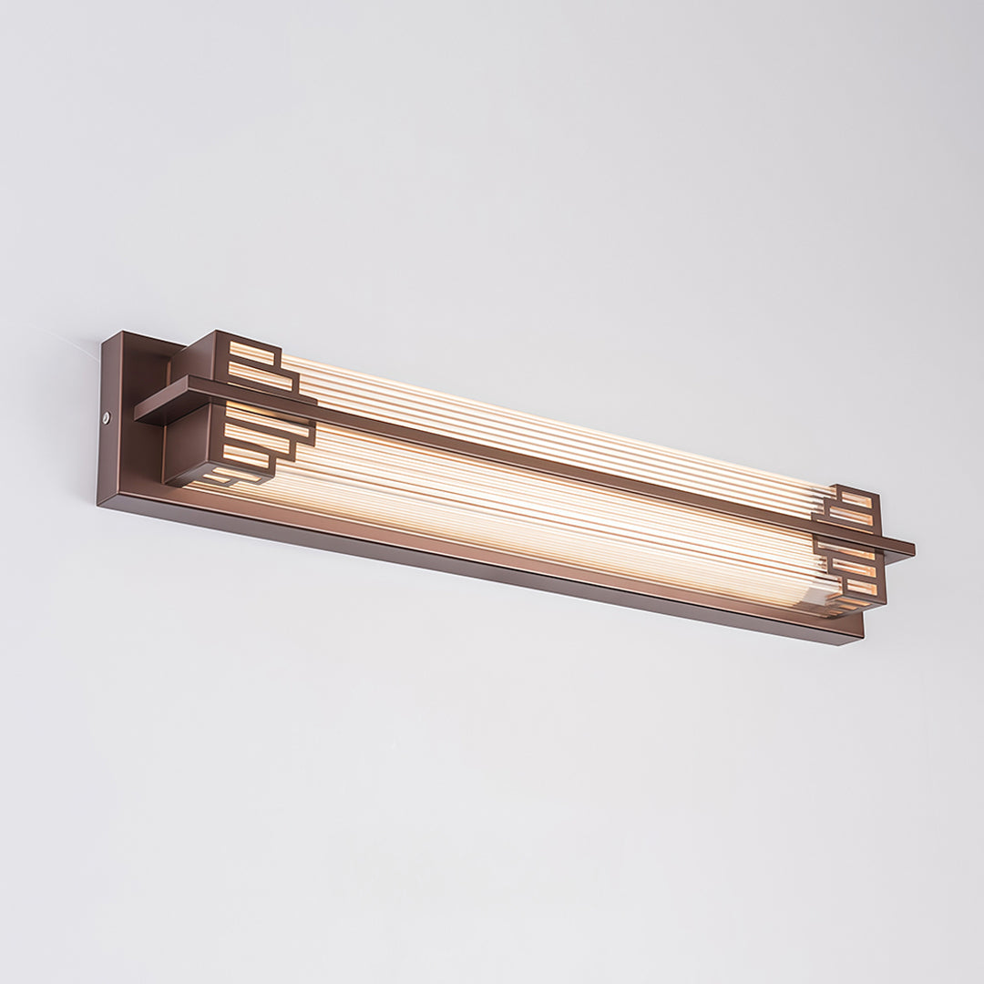 Slim outdoor wall mounted LED lights providing soft lighting along the garden fence.