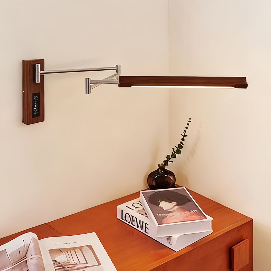 Slim profile swing wall light with a long arm and integrated LED for corner desk task lighting.