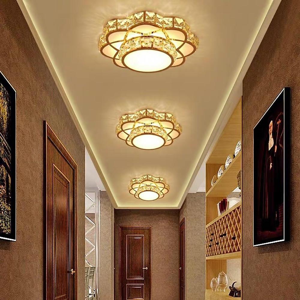 Small crystal flush mount ceiling light installed in a traditional style corridor.