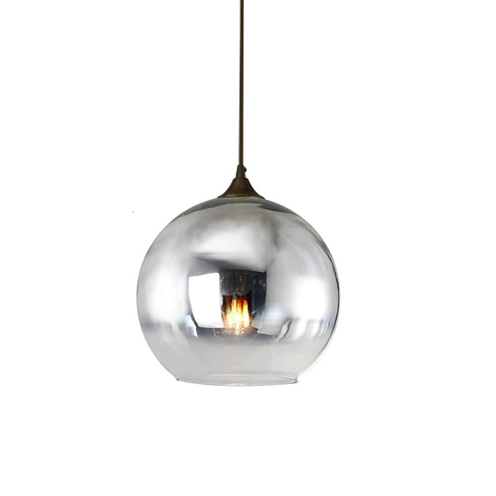 Smoked glass round pendant light with warm ambient glow.