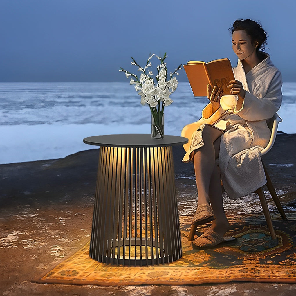 Solar coffee table with a black finish, providing elegant lighting near a sofa.