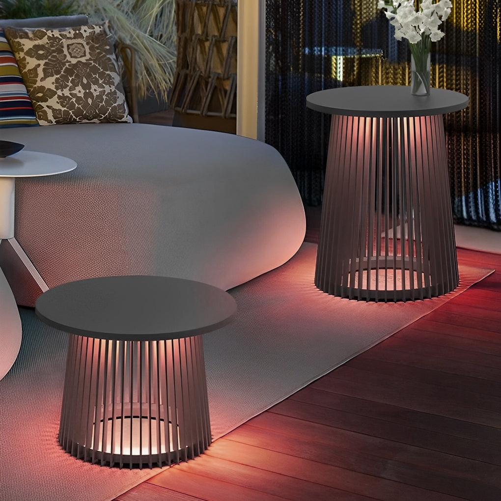 Solar coffee table with a modern design, glowing softly in a garden setting.