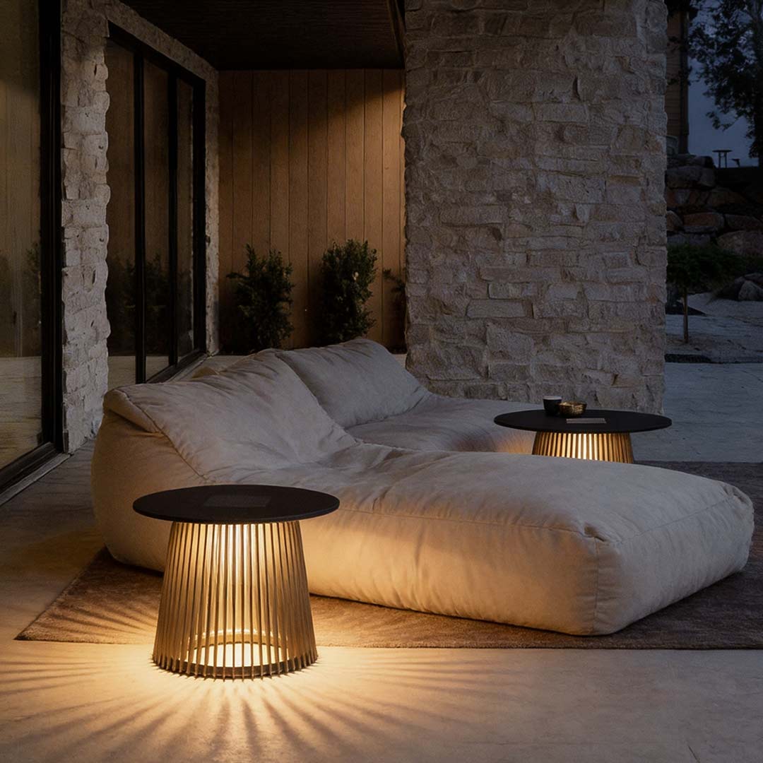 Solar coffee table with a sleek design, enhancing a cozy outdoor seating area.