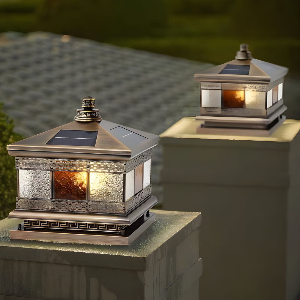 Solar column pillar lights placed on outdoor fence posts, delivering balanced illumination with a traditional lantern design.