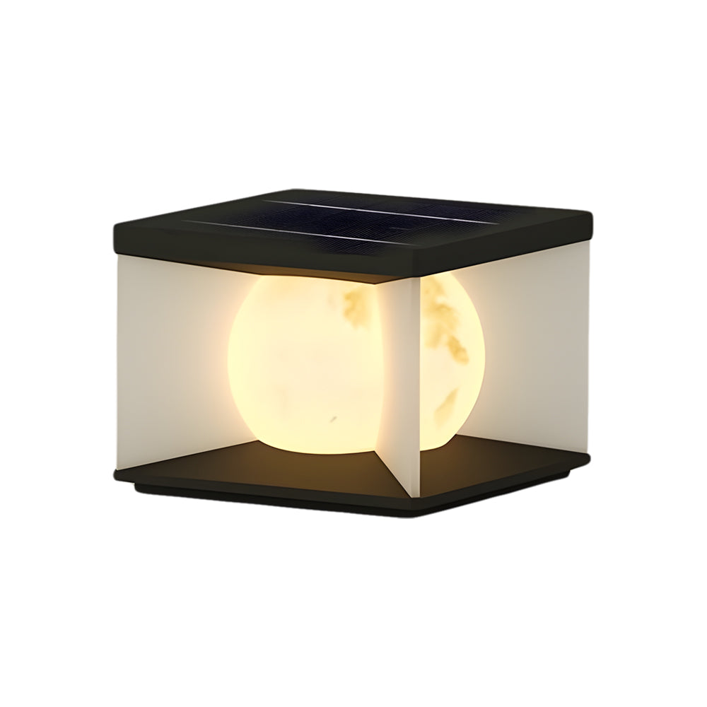 Solar outdoor cube light with black solar panel top and warm LED interior lighting