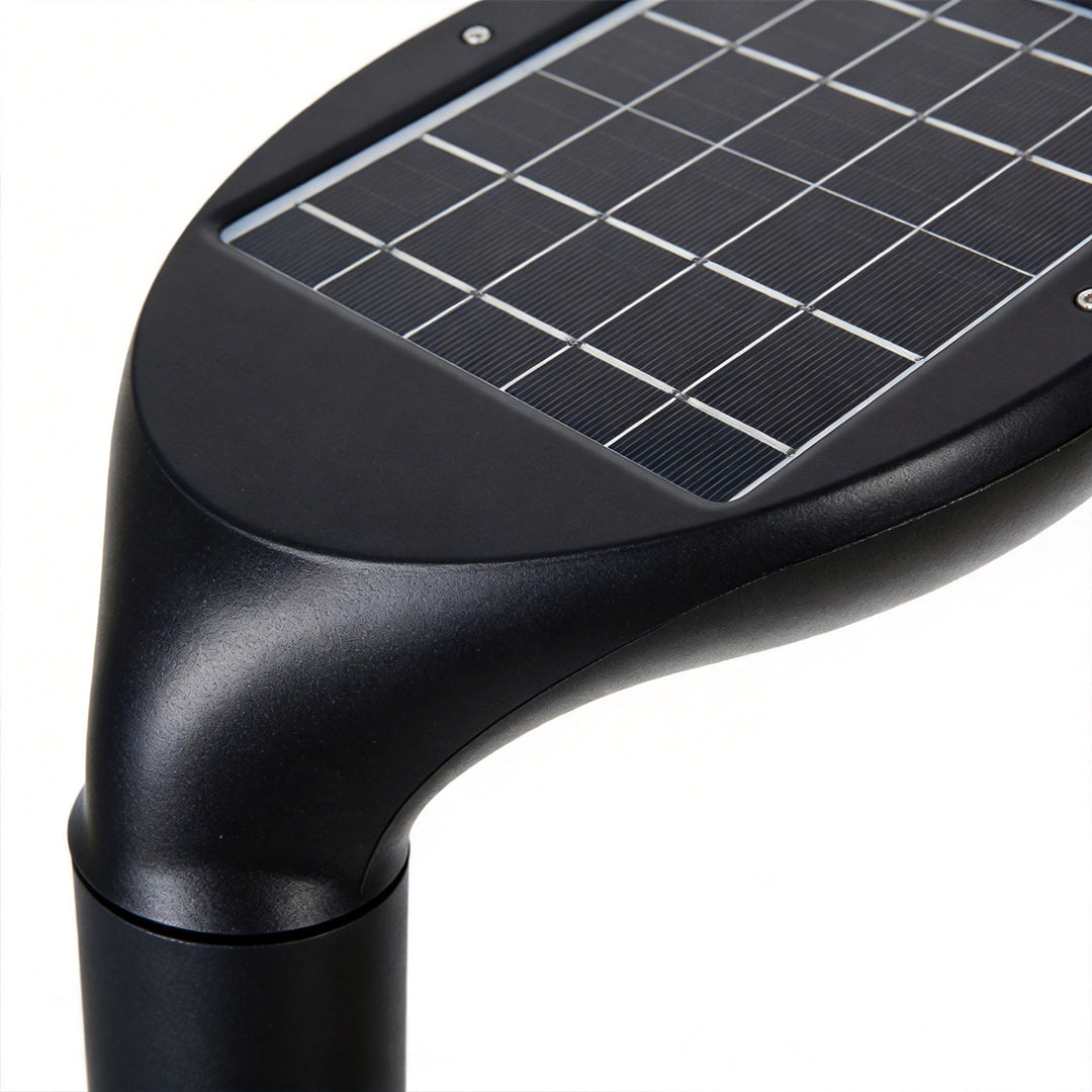 Solar panel integrated on top of curved bollard light head.