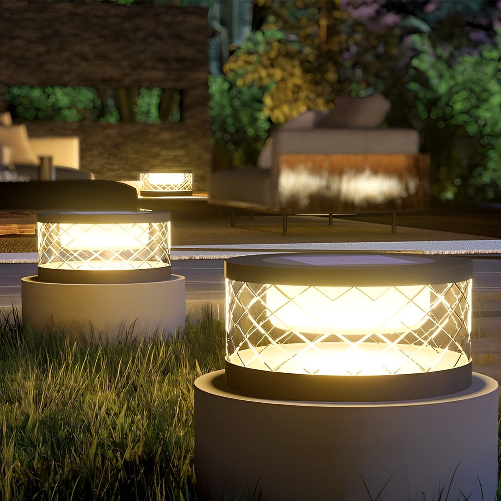 Solar cylinder pillar light with a close-up of its geometric pattern and soft glow.