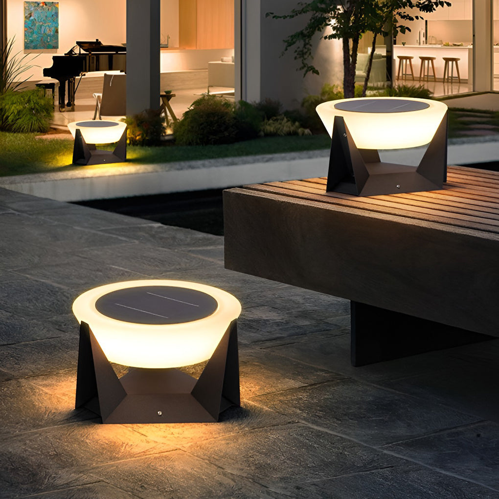 Solar fence pillar light installed along a garden pathway, offering subtle guidance lighting outdoors.