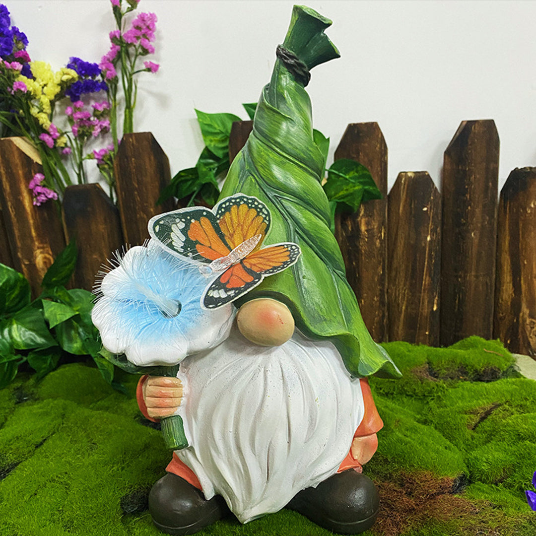 Solar gnomes garden lights enhancing a garden fence with a gnome and butterfly.