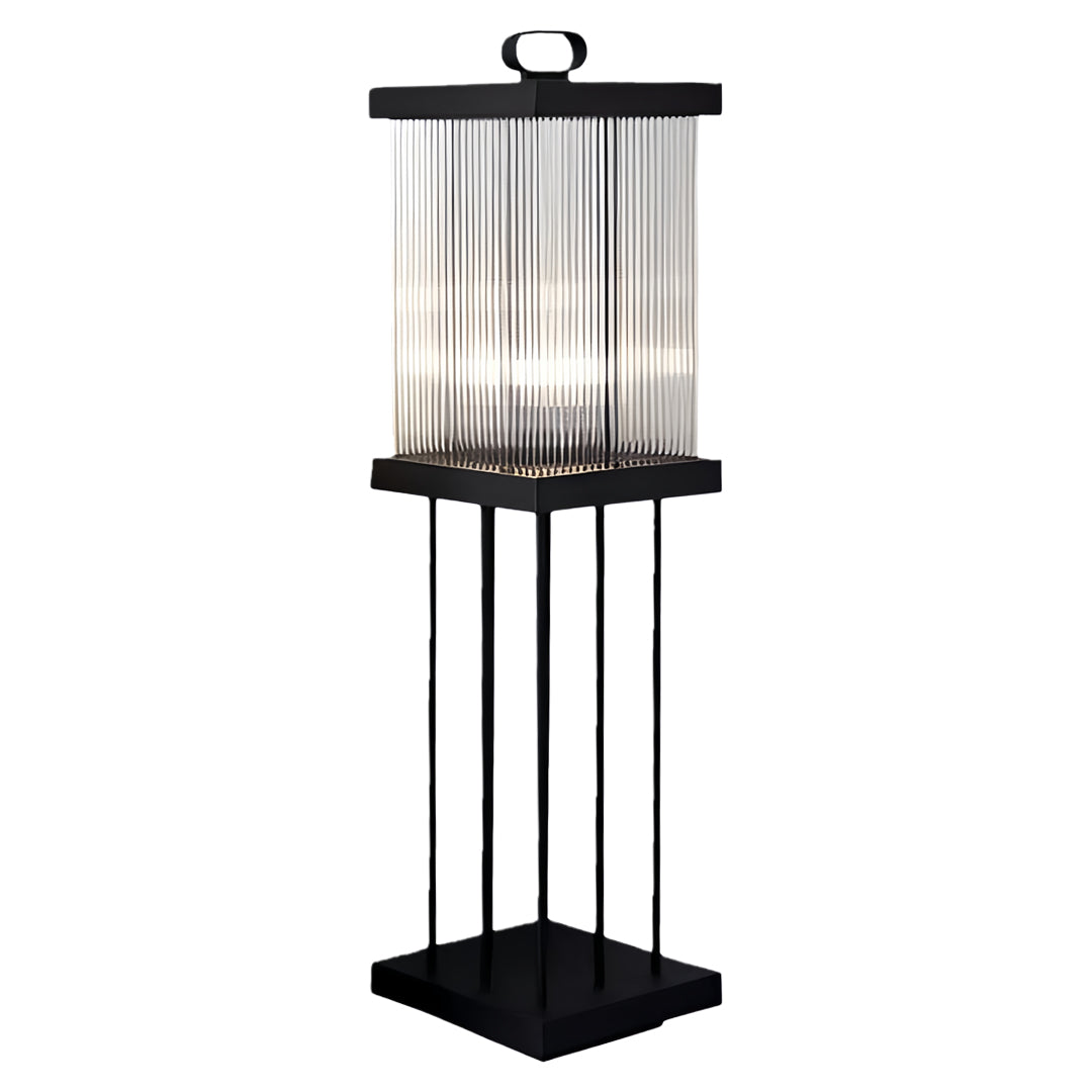 Solar lantern mounted on tall metal base for garden lighting.