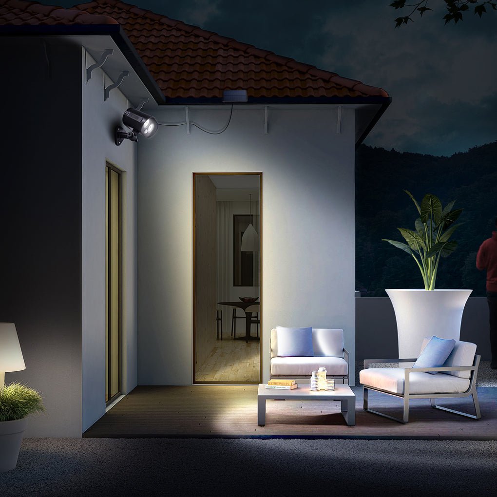 Exterior wall installation of a solar motion sensor lamp with adjustable solar panel.