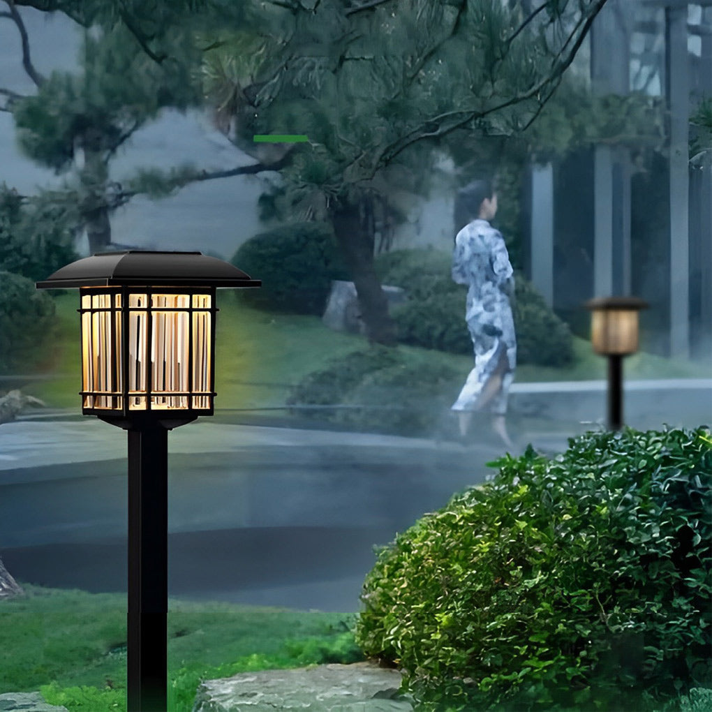 Solar outdoor lawn light with a modern black finish, enhancing a garden's ambiance.