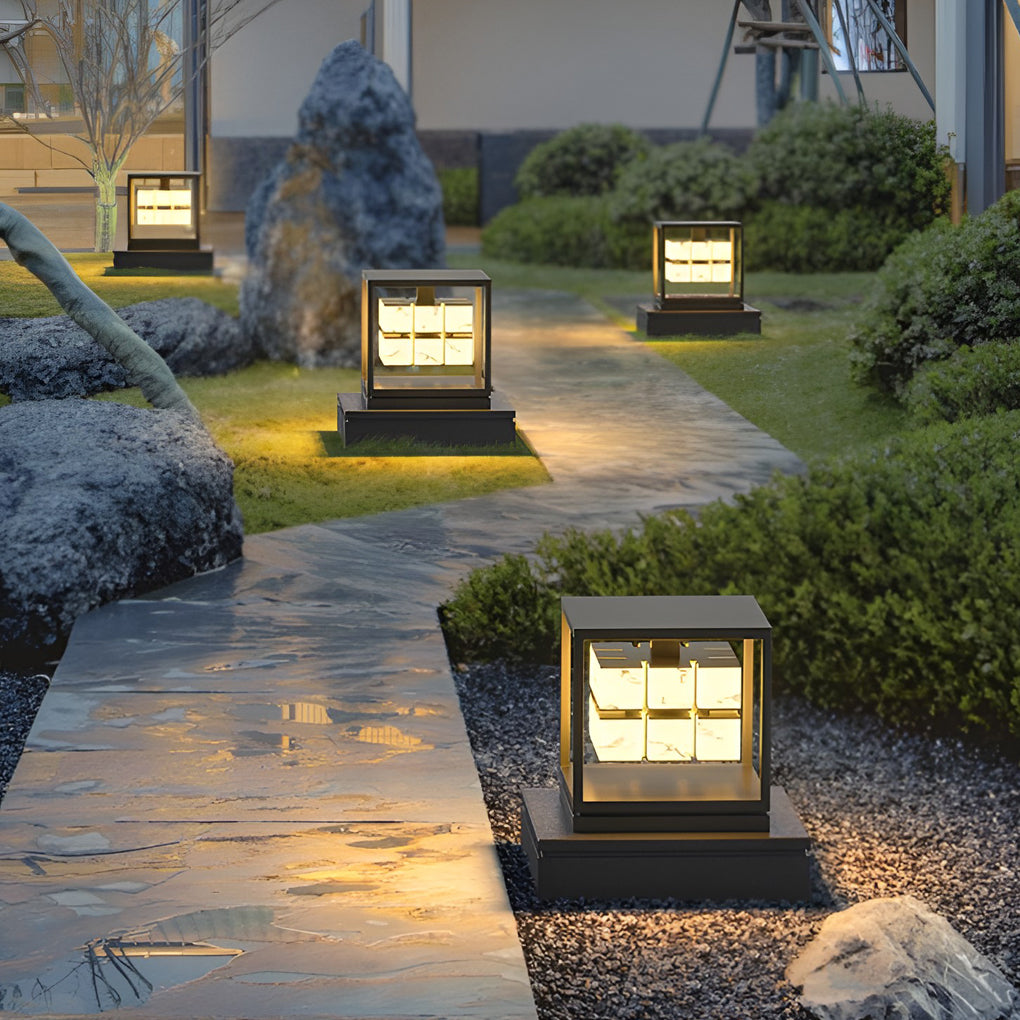 Solar pillar lights around outdoor water feature