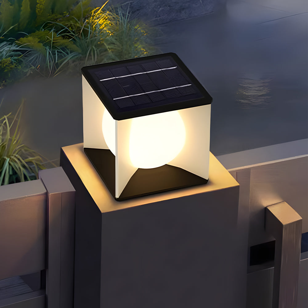 Modern solar post cap light illuminating outdoor deck railing during evening hours