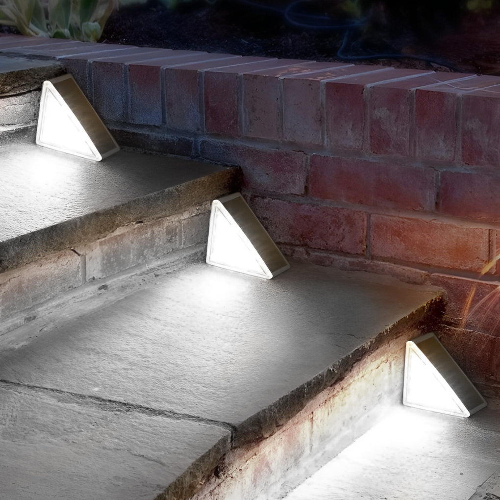 Bright white solar powered lights for steps mounted on brick stairs, improving safety and modern outdoor aesthetics.