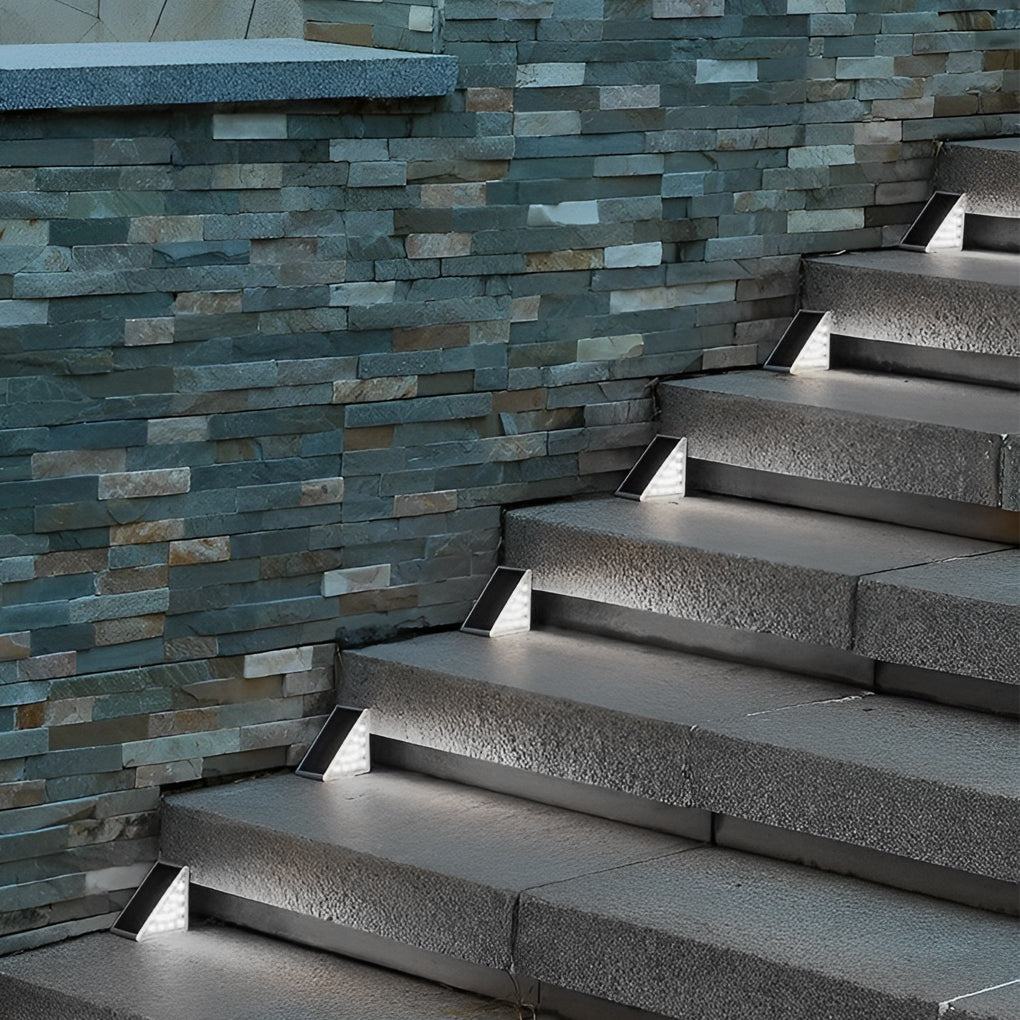 Minimalist solar powered lights for steps installed on a curved staircase, enhancing visibility and modern design.