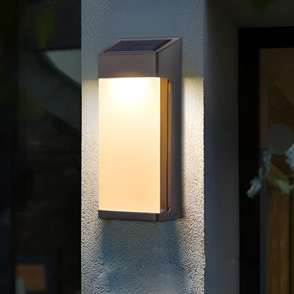 Solar powered outdoor sconces with modern black frame mounted on exterior wall at dusk.