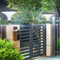 Solar-powered pillar light placed along a driveway, offering illumination for the outdoors.