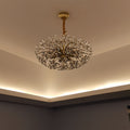 Sophisticated crystal flower chandelier mounted in elegant room with ambient lighting