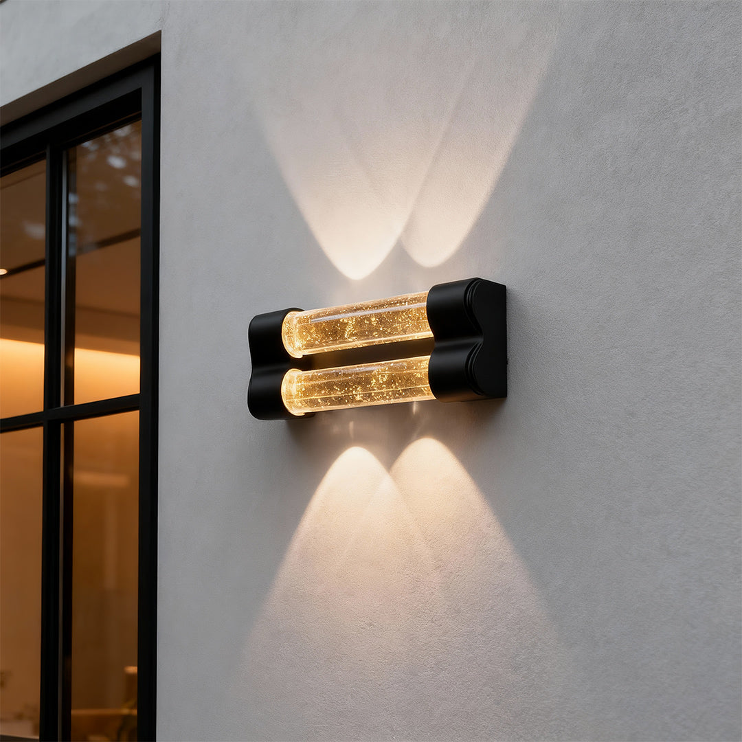 Sophisticated crystal wall sconce light fixture featuring glass shade chandelier influence with dramatic bidirectional light spread.
