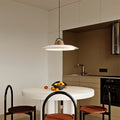 Sophisticated single pendant lights for kitchen with warm wood accents in modern culinary environment