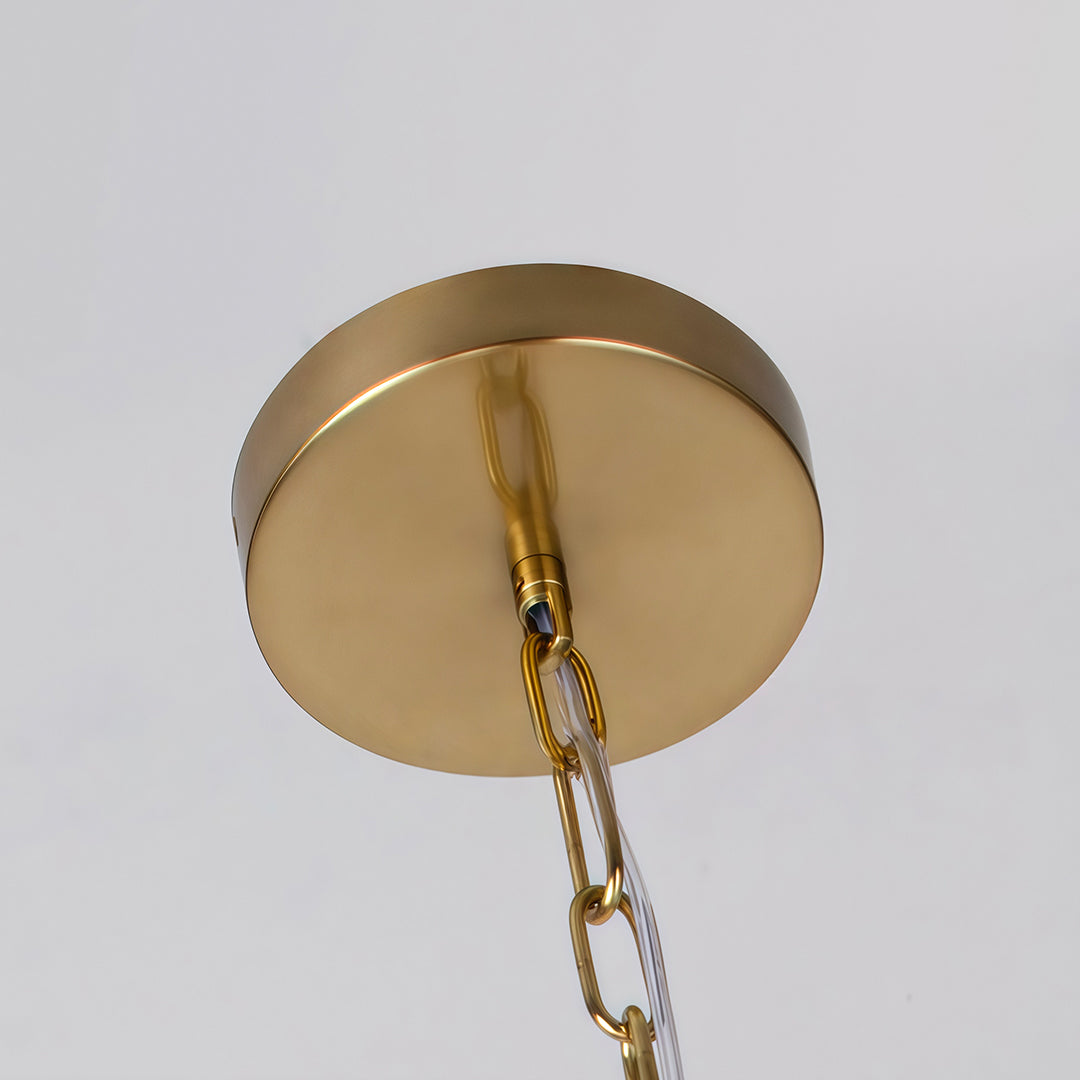 Sturdy brass canopy and chain suspension supporting the spiral globe chandelier.