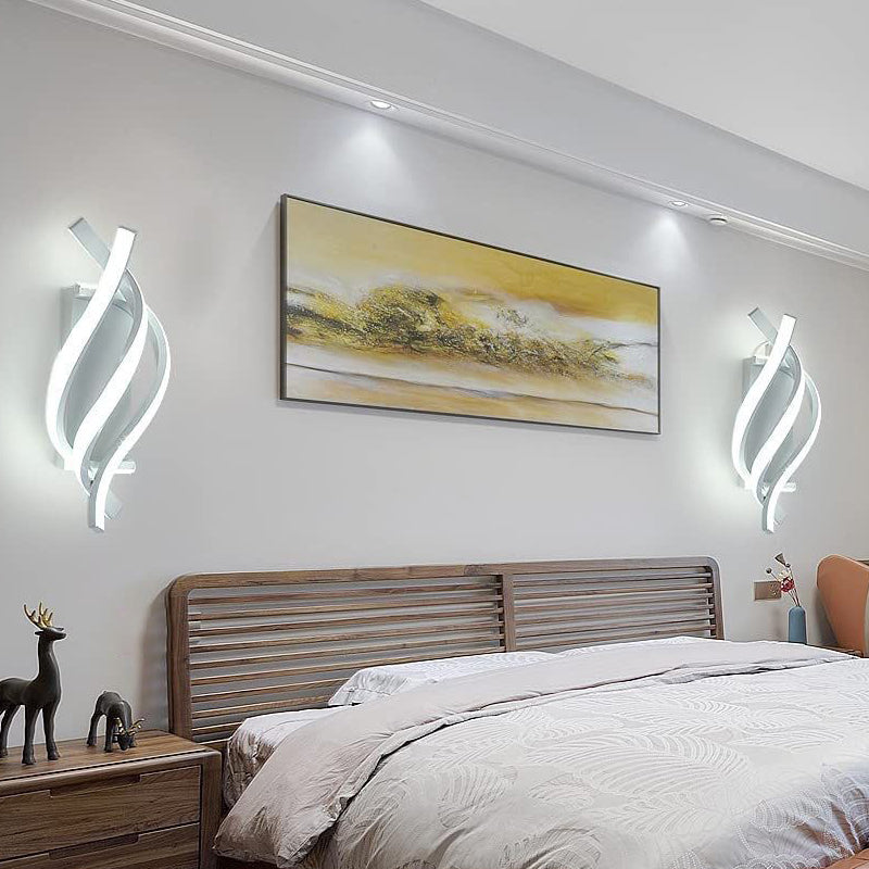Spiral wall sconce with a close-up of the twisted metal design.