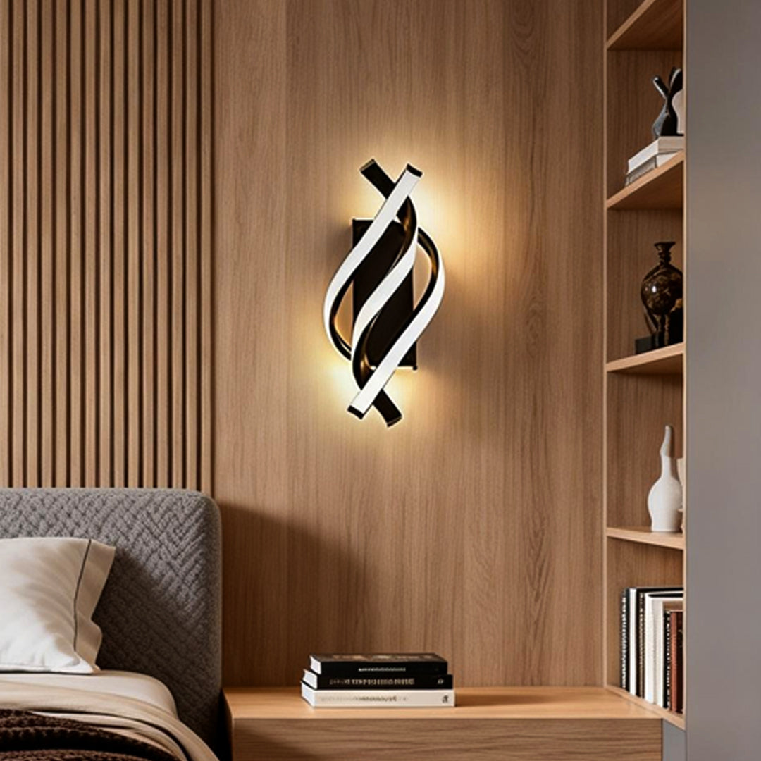 Spiral wall sconce illuminating a modern living room with warm, ambient glow.