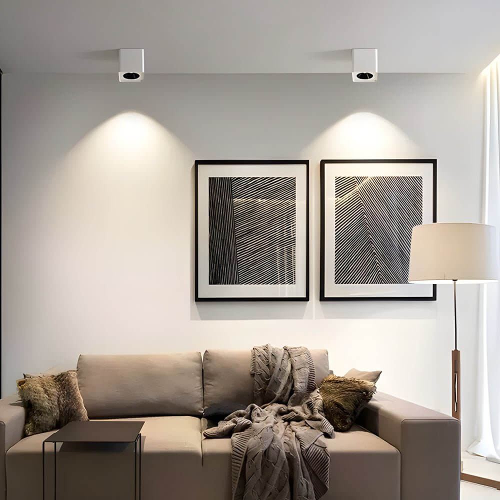 Spotlight LED square with dual light heads, installed in a modern living room.