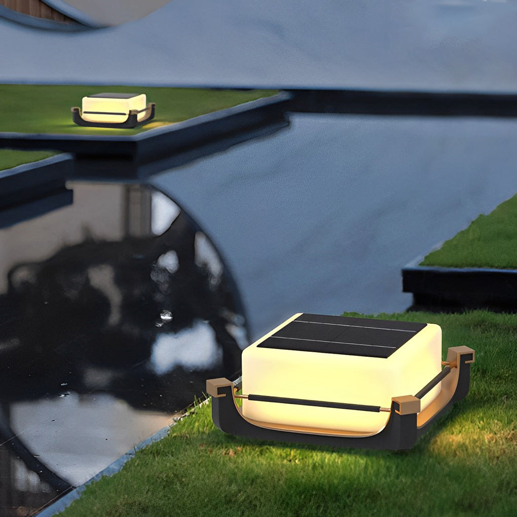 Square acrylic pier light positioned on grass edge near water, blending natural scenery with modern lighting design.