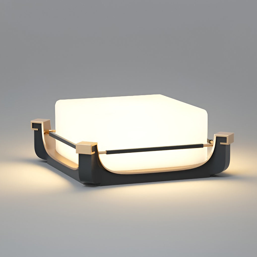 Square acrylic pier light used on low walls near landscaped trees, adding warm glow to outdoor architecture.