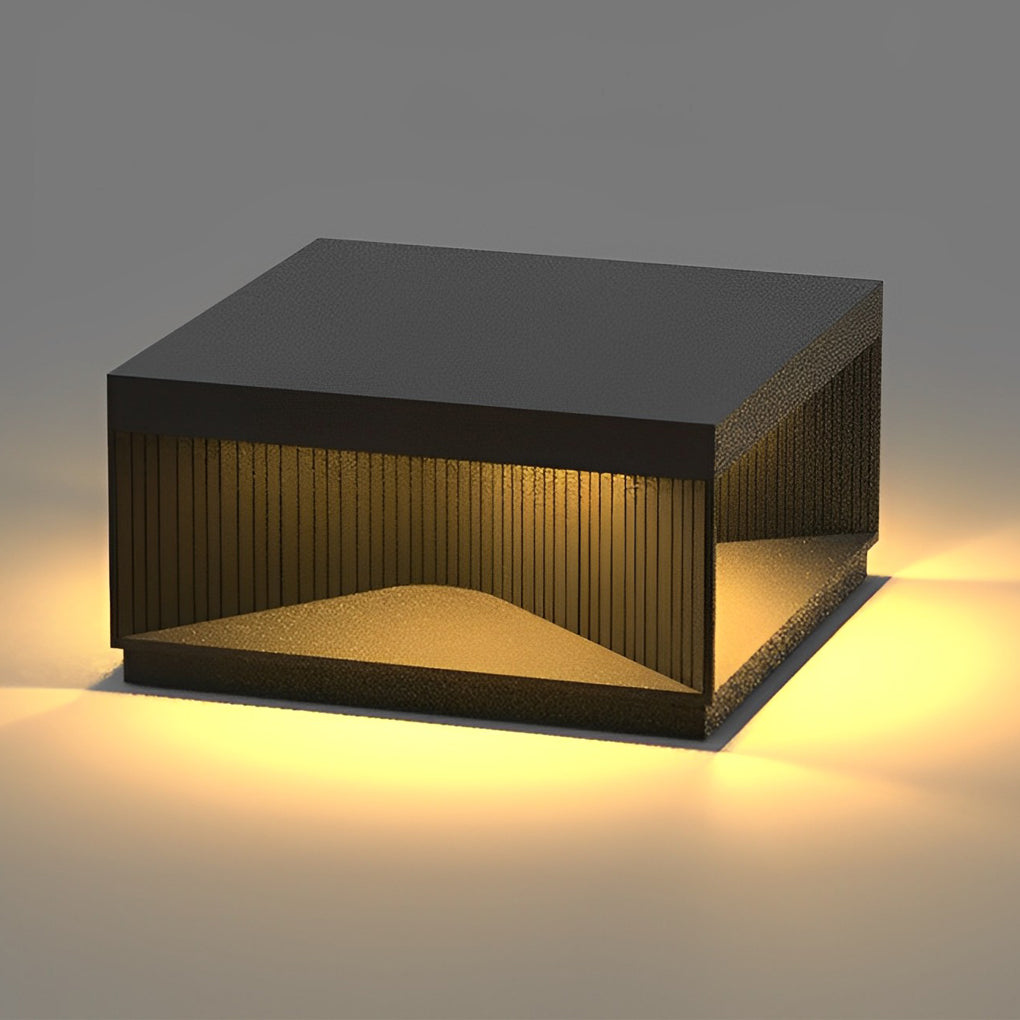 Square outdoor pillar lights used as accent lighting near outdoor seating and fire pit area.