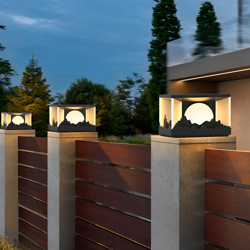 Square outdoor pillar lights enhancing a stone wall with elegant, directional lighting.
