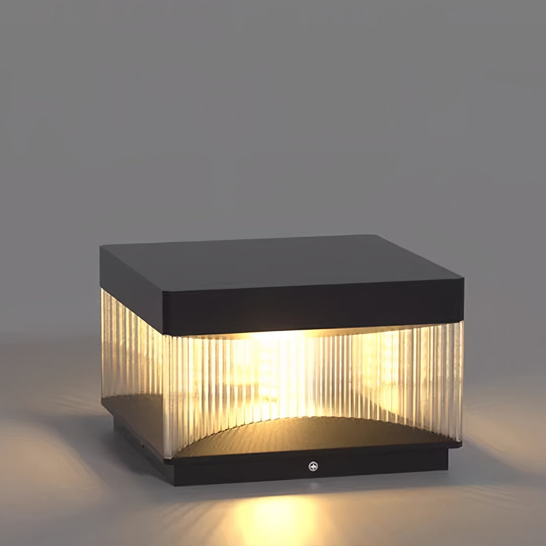 Square pillar lights showcasing modern cube design with textured light panel on gray backdrop