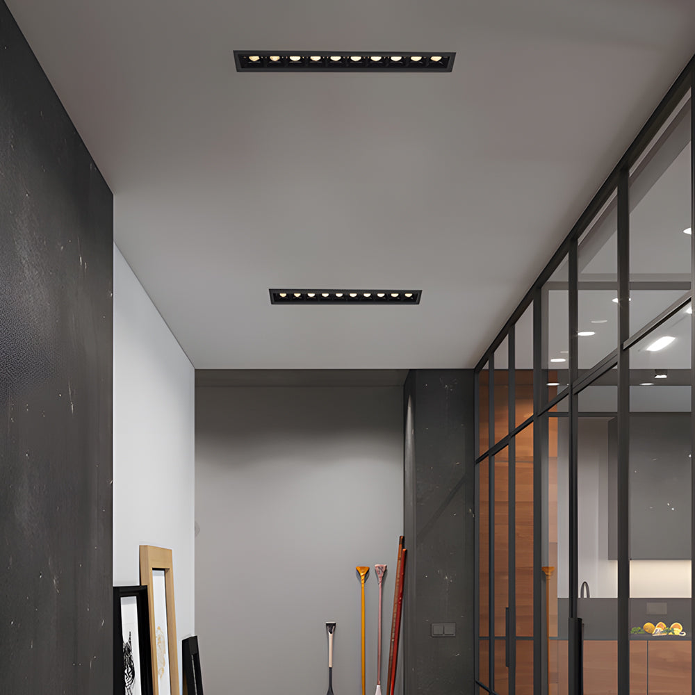 Single square recessed ceiling spot light housing for focused downlighting.