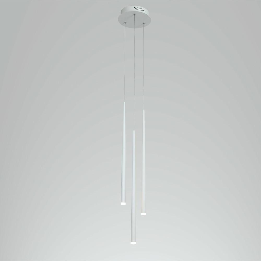 Staggered trio of modern white multi head pendant lights isolated on a light grey background.