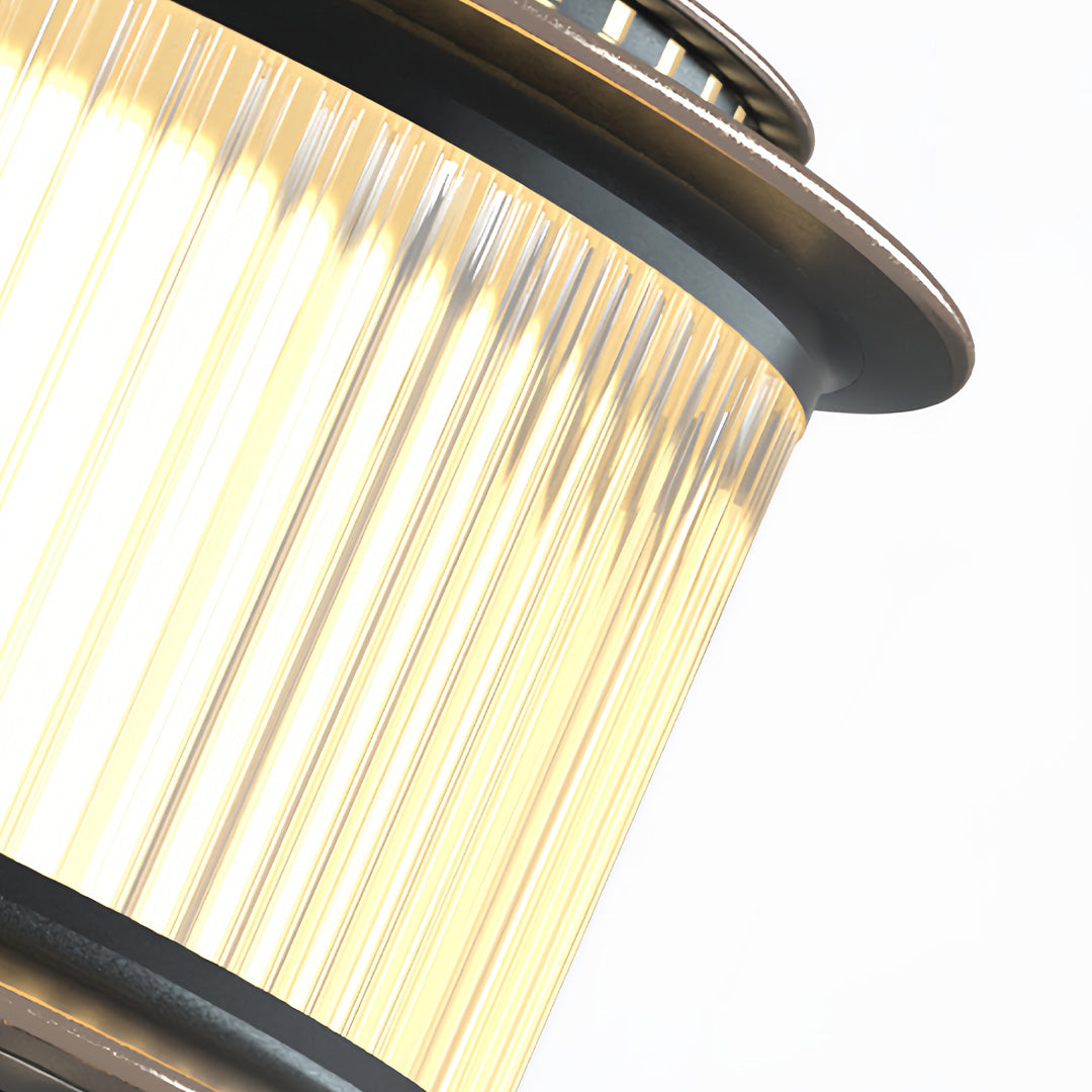 Stainless steel pillar lights with ribbed diffuser combine modern durability with evenly distributed outdoor lighting.