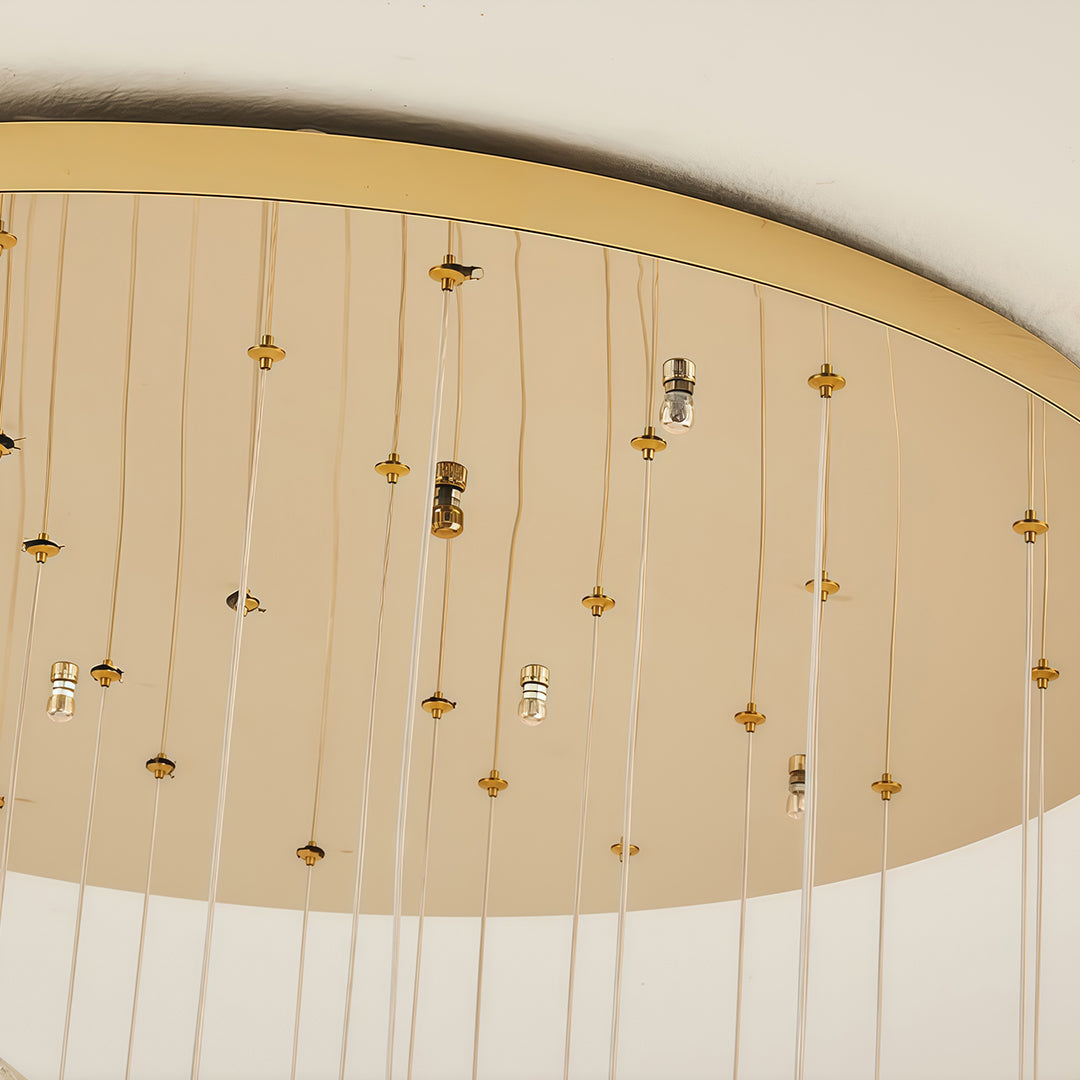 Ceiling canopy of staircase crystal chandelier with multiple hanging wires.
