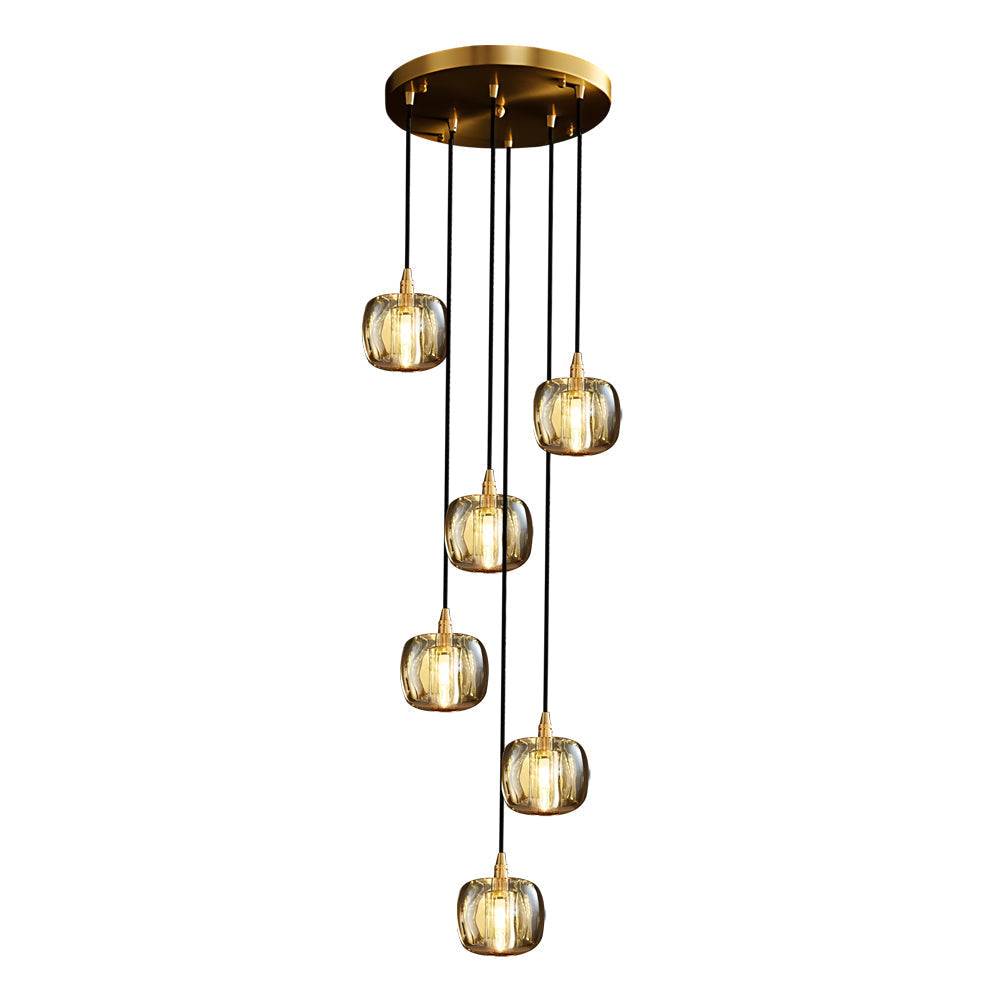 Staircase crystal chandelier with golden accents, providing soft illumination in a hallway.