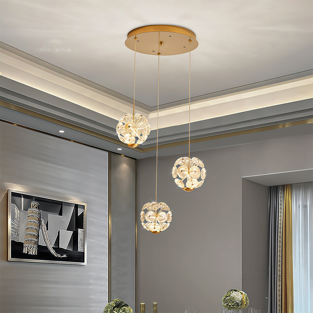 Small staircase crystal chandelier installed above living room area.