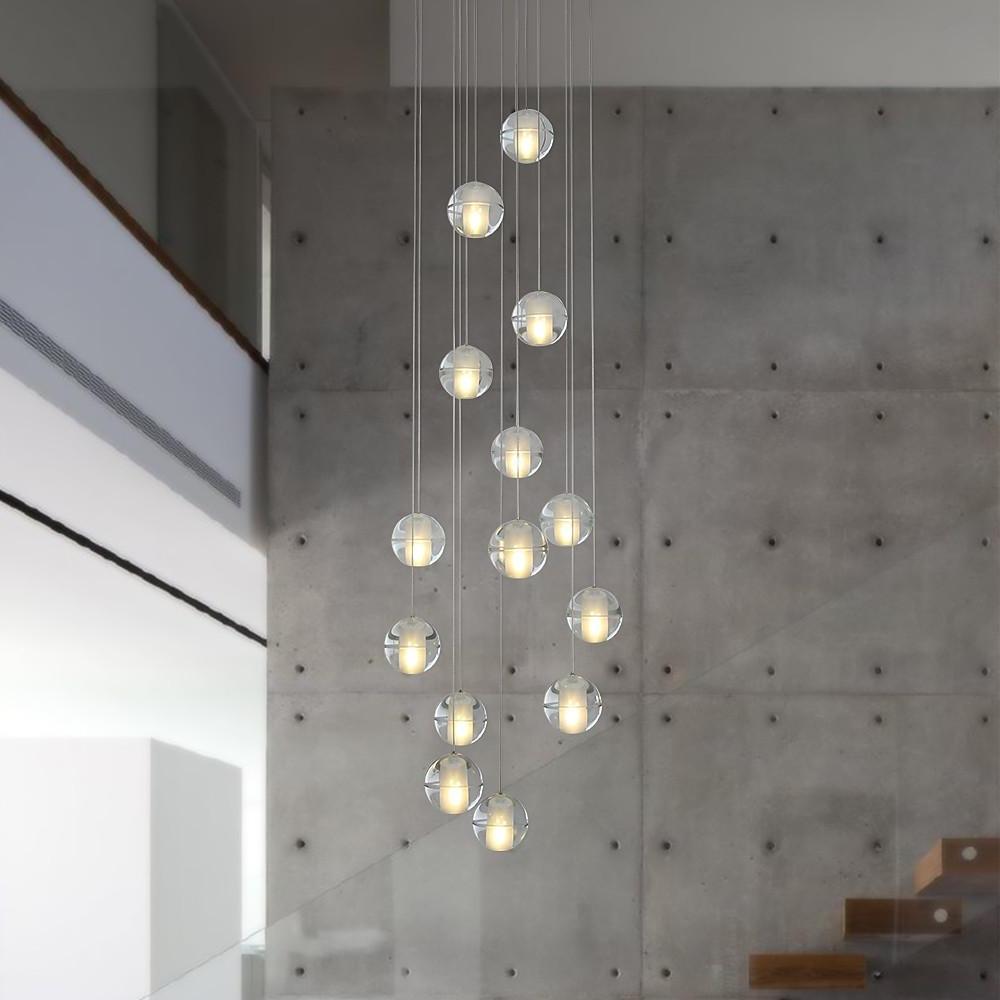Staircase hanging chandelier illuminating a stylish staircase with ambient light.