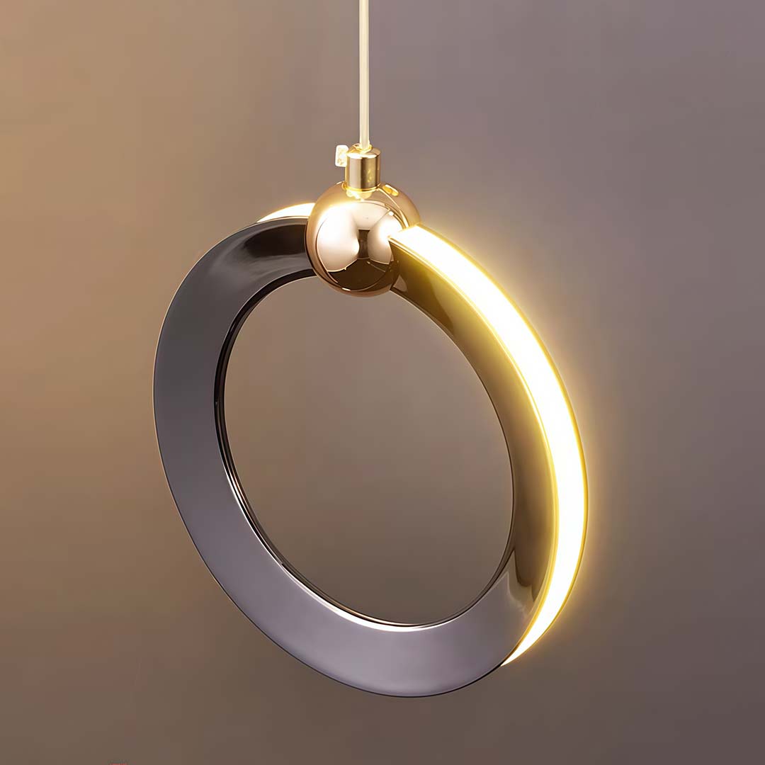 Staircase lighting chandelier with a close-up of its illuminated rings and ceiling mount.
