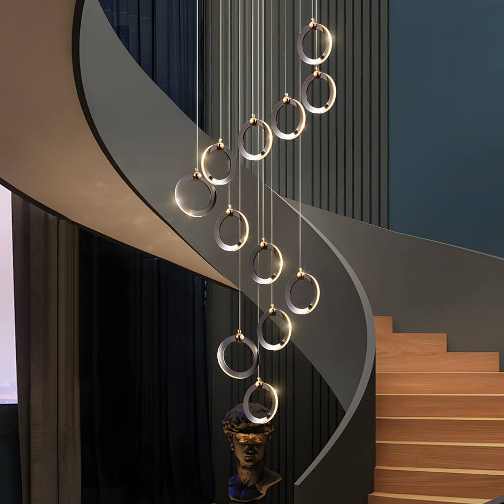 Staircase lighting chandelier with a modern design, providing ambient light in a hallway.