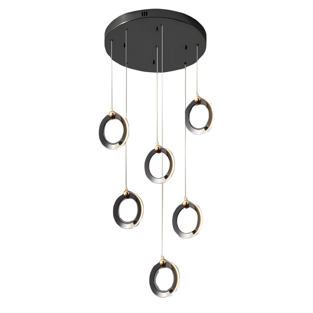 Staircase lighting chandelier with a modern design, illuminating a grand staircase.