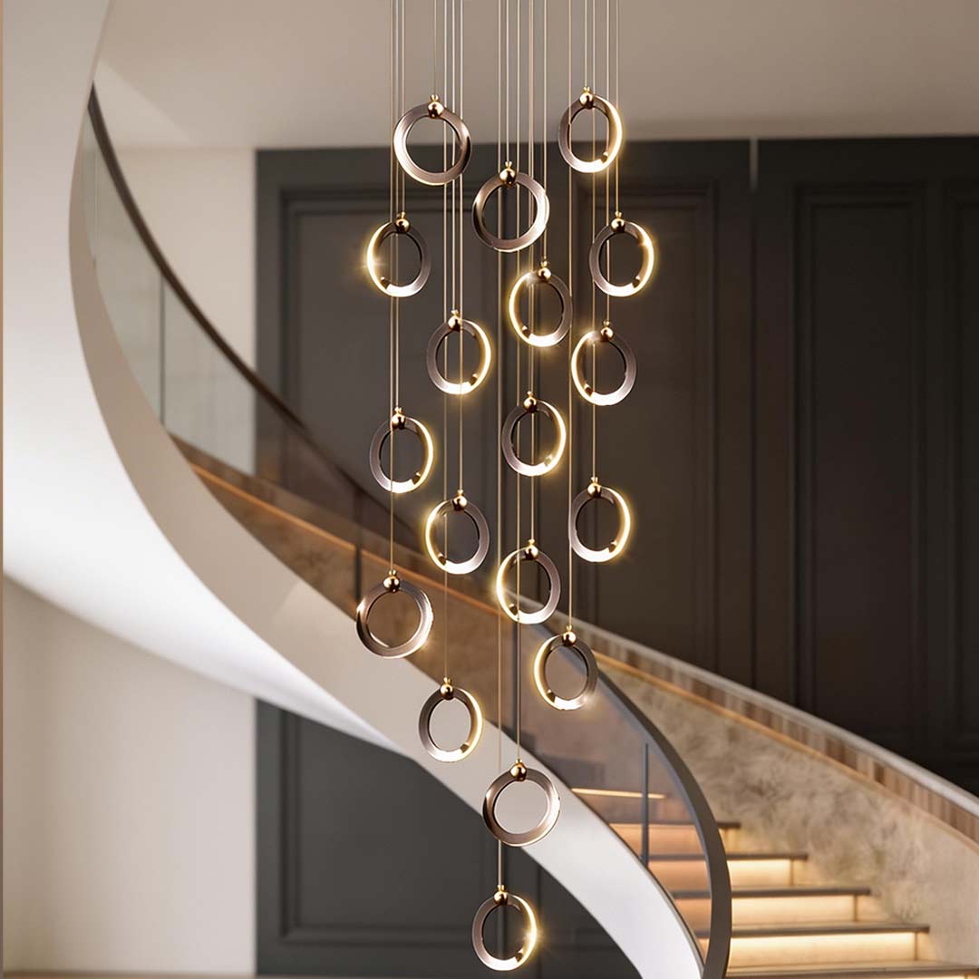 Staircase lighting chandelier with a sleek design, enhancing a luxurious living room.