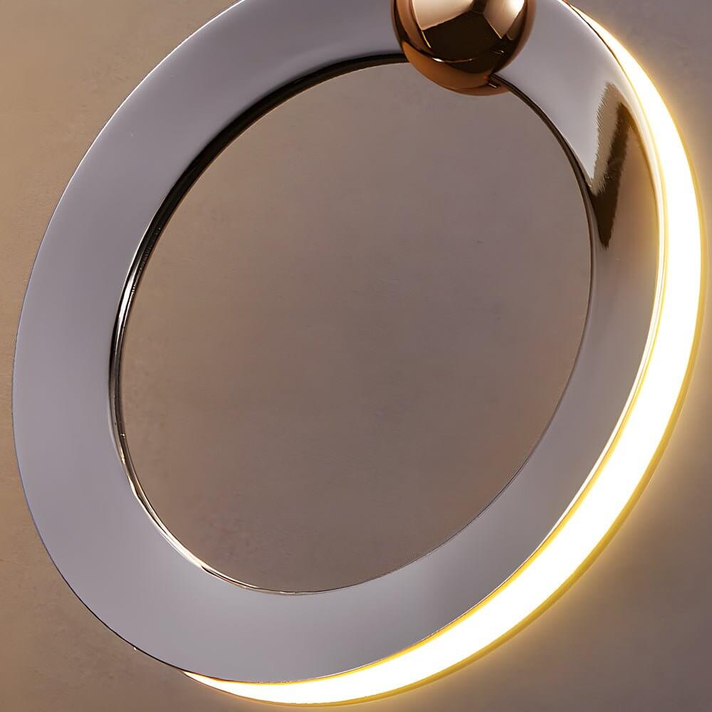 Staircase lighting chandelier with a sleek design, providing soft light in a dining area.