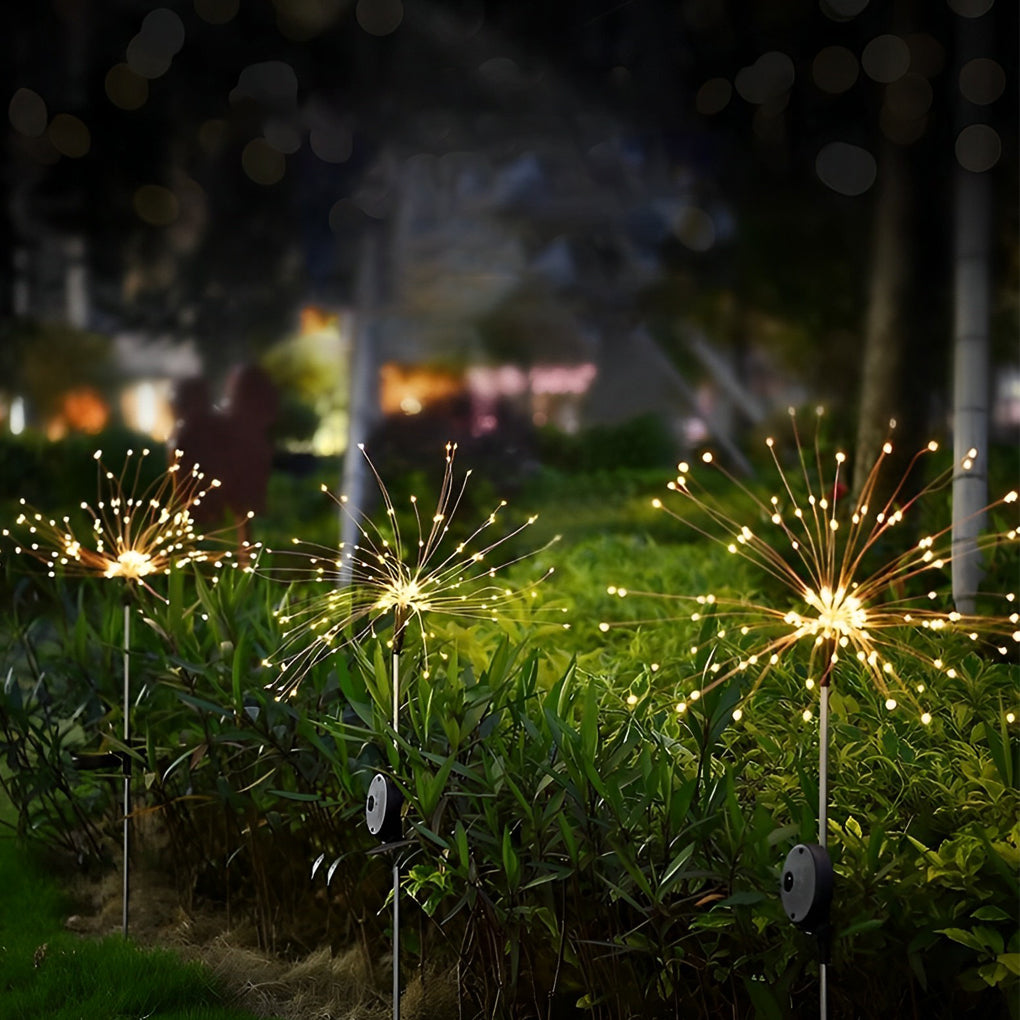 Starburst garden lights illuminating a grassy area, adding a festive touch to the outdoor space.